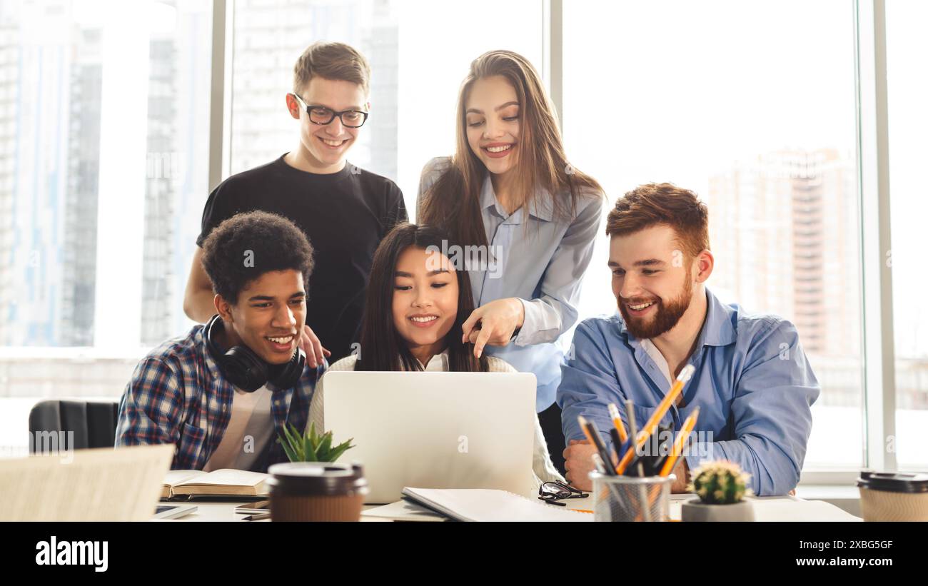 Group learning session with devices in library Stock Photo