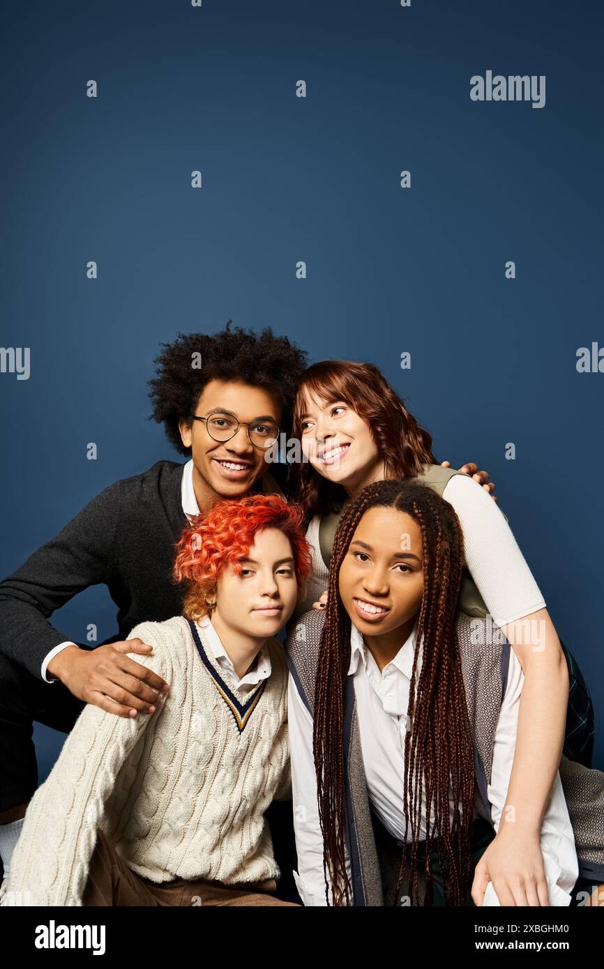 Multicultural Blue Multicultural friends strike a pose in trendy outfits on a dark blue ...