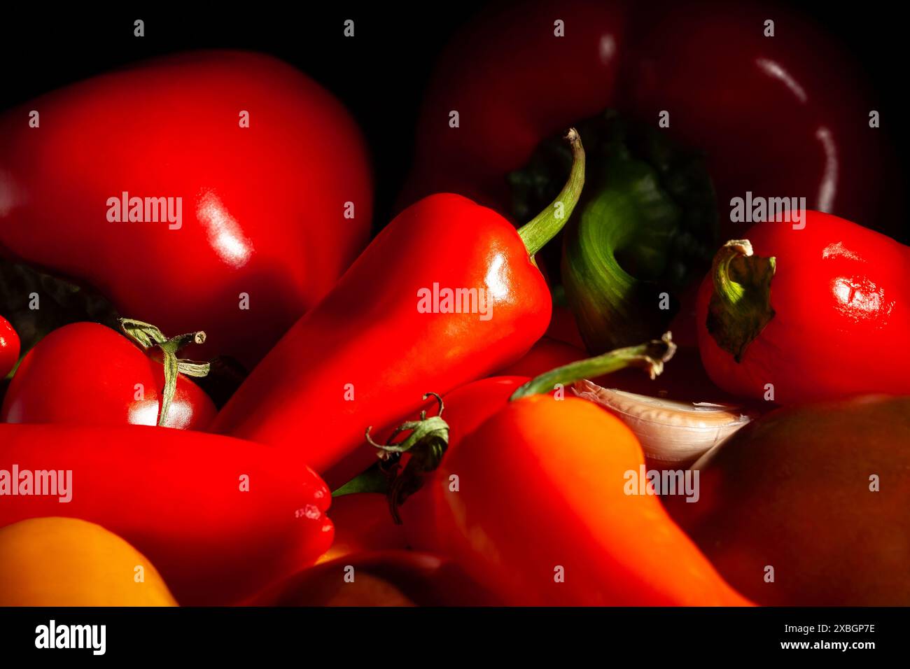 mini bell pepper mix on black background Stock Photo