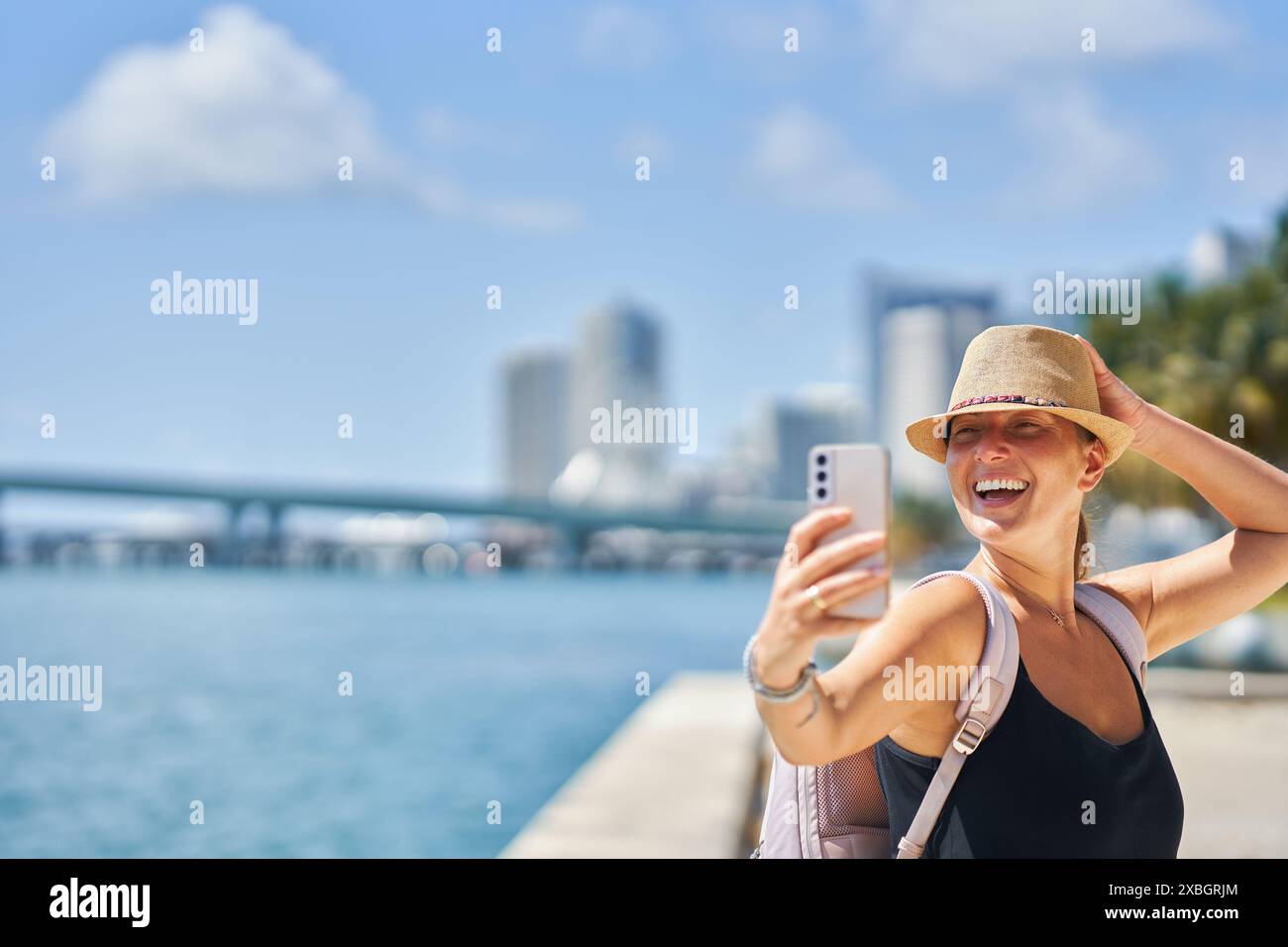 Portrait of smiling woman at the waterfront hi-res stock photography ...