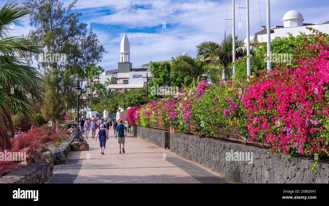 Lanzarote, Canary Islands, Spain - January 24, 2024: View of a tropical walkway with a beautiful floral design on the beach in Yaiza village in Lanzar Stock Photo