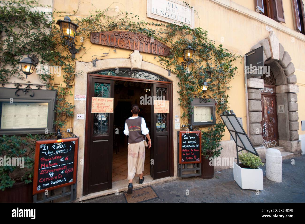 Italy, Lazio, Rome. Trastevere District, Via della Lungaretta Street, Antica Osteria Rugantino Tavern Restaurant Stock Photo