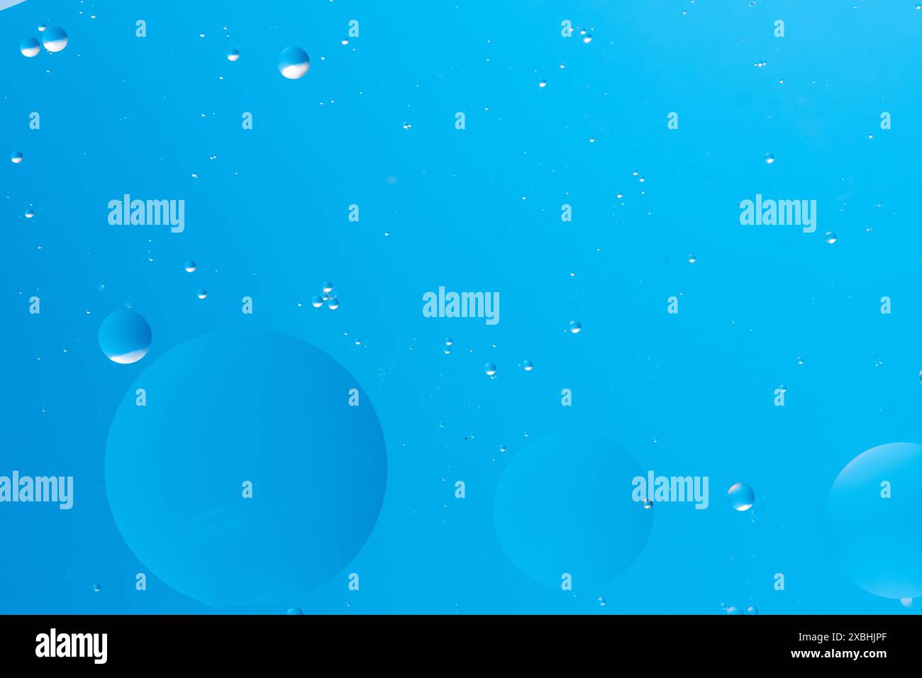Light blue background with various blue bubbles floating Stock Photo ...