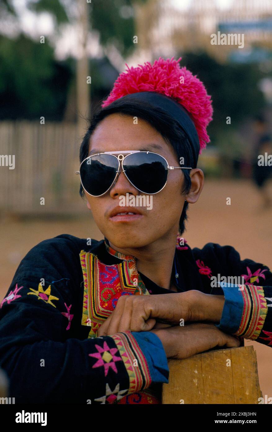 Hmong village, Pa Kludy, Northern Thailand SE Asia. Man in traditional every day clothes and western influence a pair of stylish Aviator style sunglasses. 1990s Circa 1995 HOMER SYKES Stock Photo