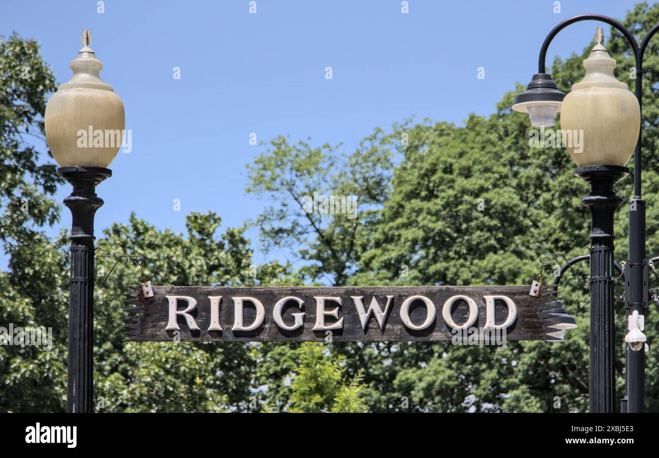 ridgewood-sign-on-entrance-to-train-station-platform-train-track-in