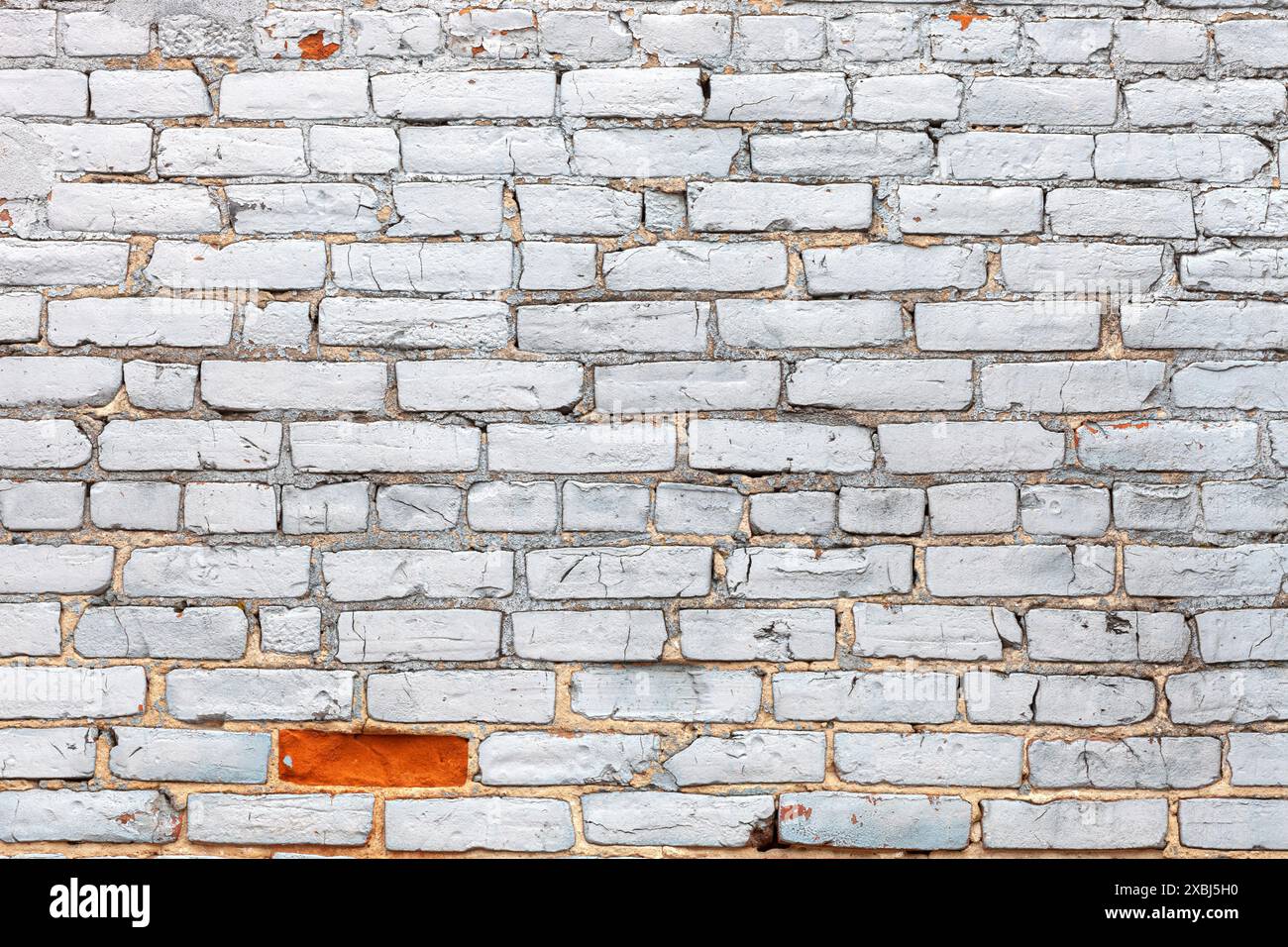 Grunge brick wall texture painted white with one missing paint Stock Photo