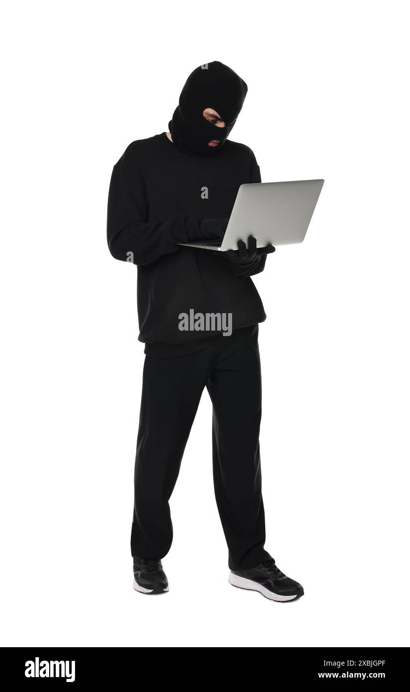 Thief in balaclava with laptop on white background Stock Photo - Alamy