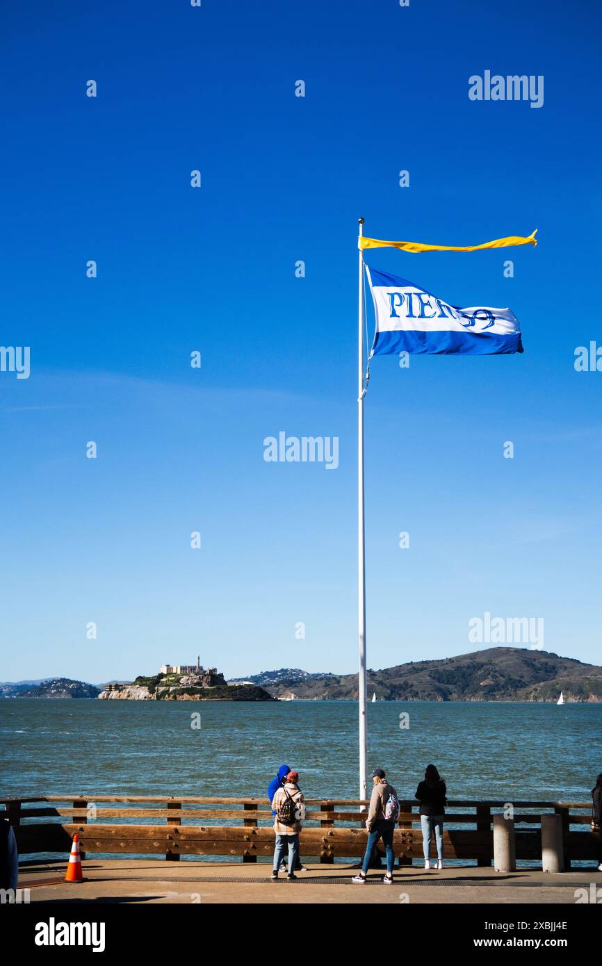 Pier Flag Pier 39 flag with person looking across San Francisco Bay to Alcatraz ...