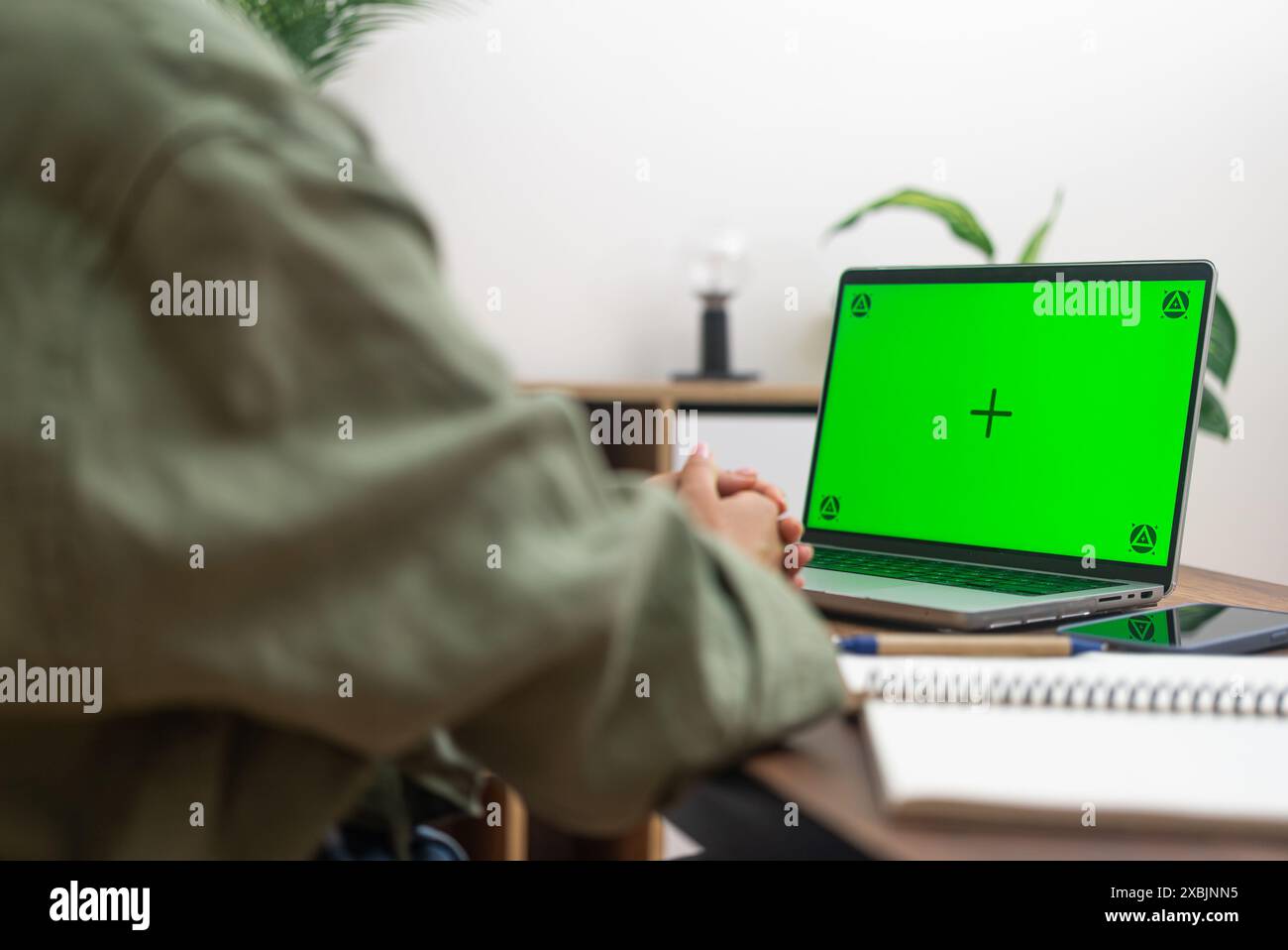 patient utilizes laptop with chroma key for an online call with doctor, online medical consultation Stock Photo
