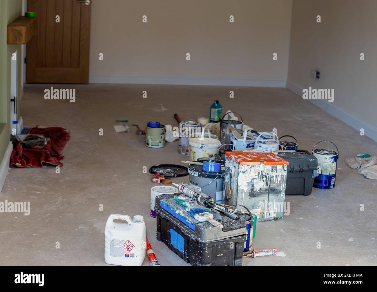 Tidy interior painting setup with tools and paint cans – Whitehouse professional Northampton process
