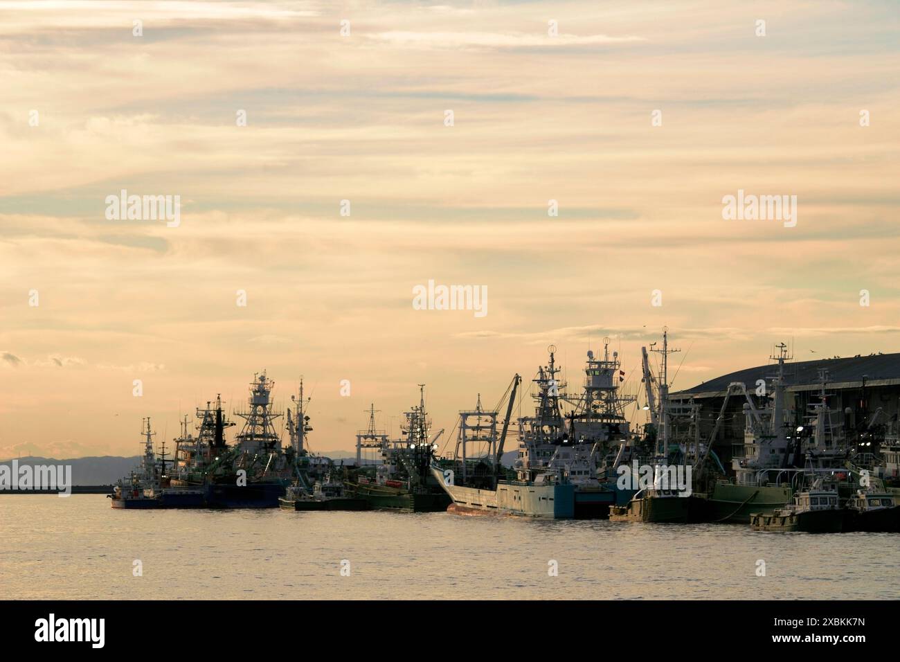 Kushiro Port at dusk with fishing vessels anchored Stock Photo