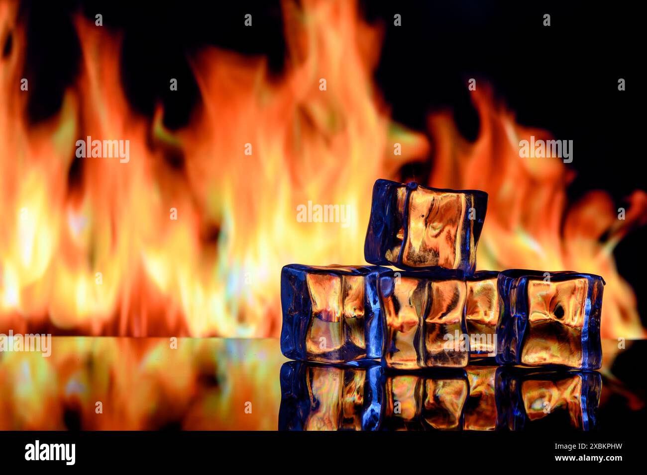 ice cubes on a black background in flames 4 Stock Photo - Alamy