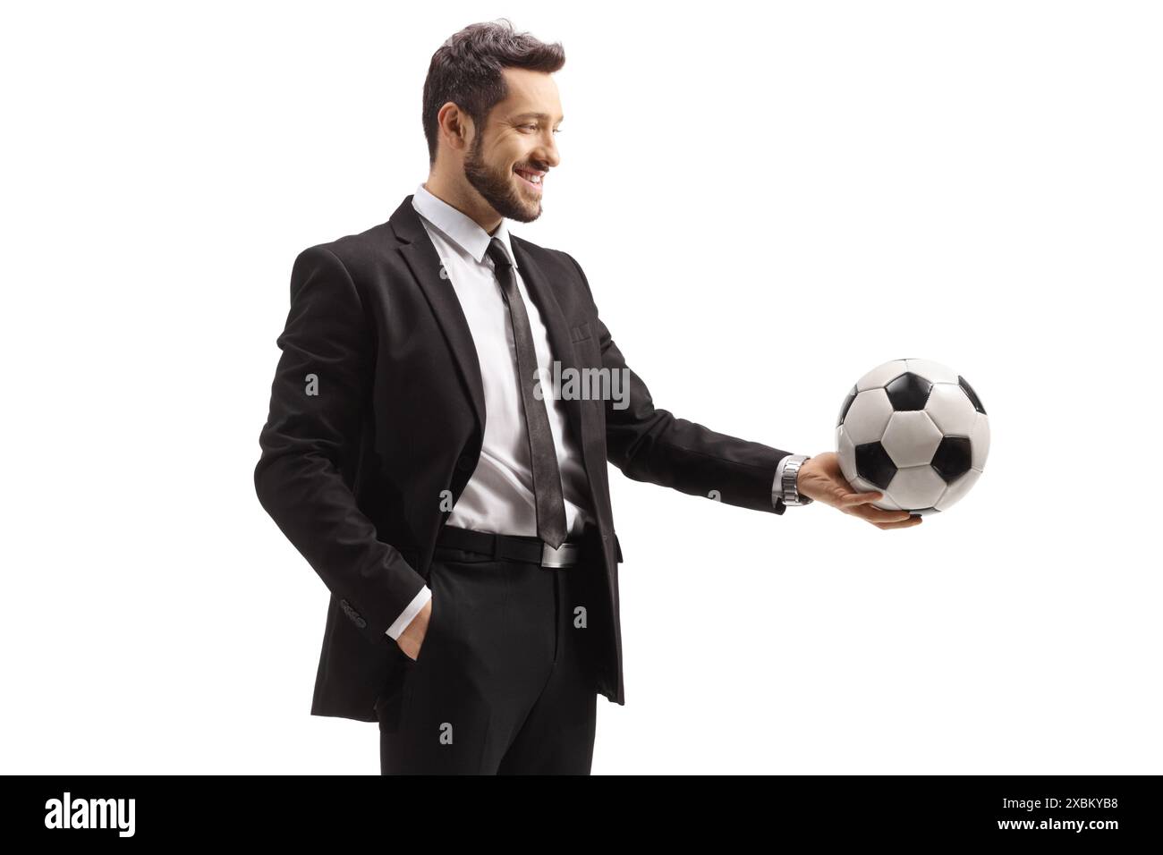 Man in a suit holding a soccer ball isolated on white background Stock ...