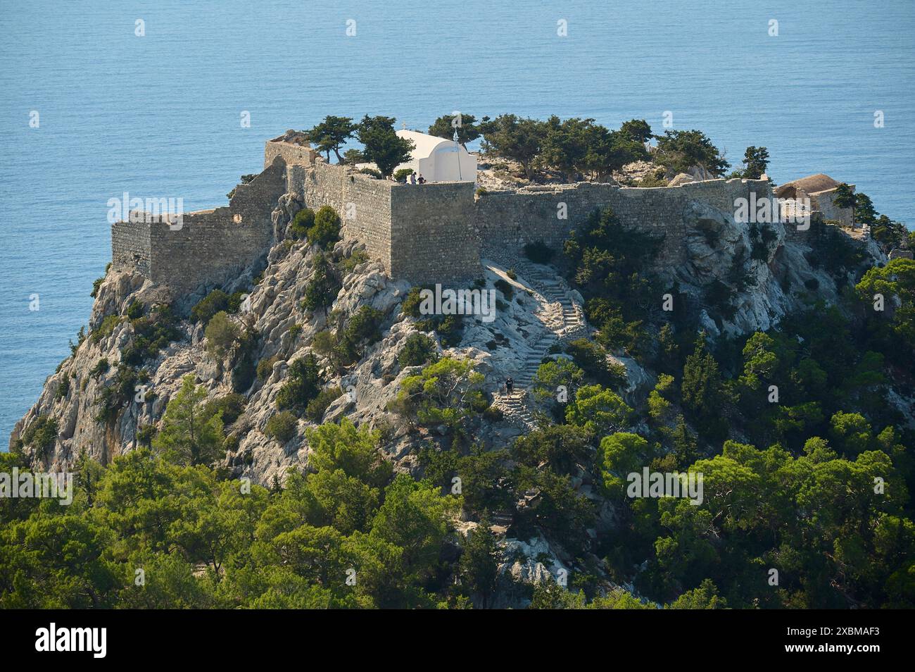 An old castle on a rocky hill overlooking the sea, Kastro Monolithou ...