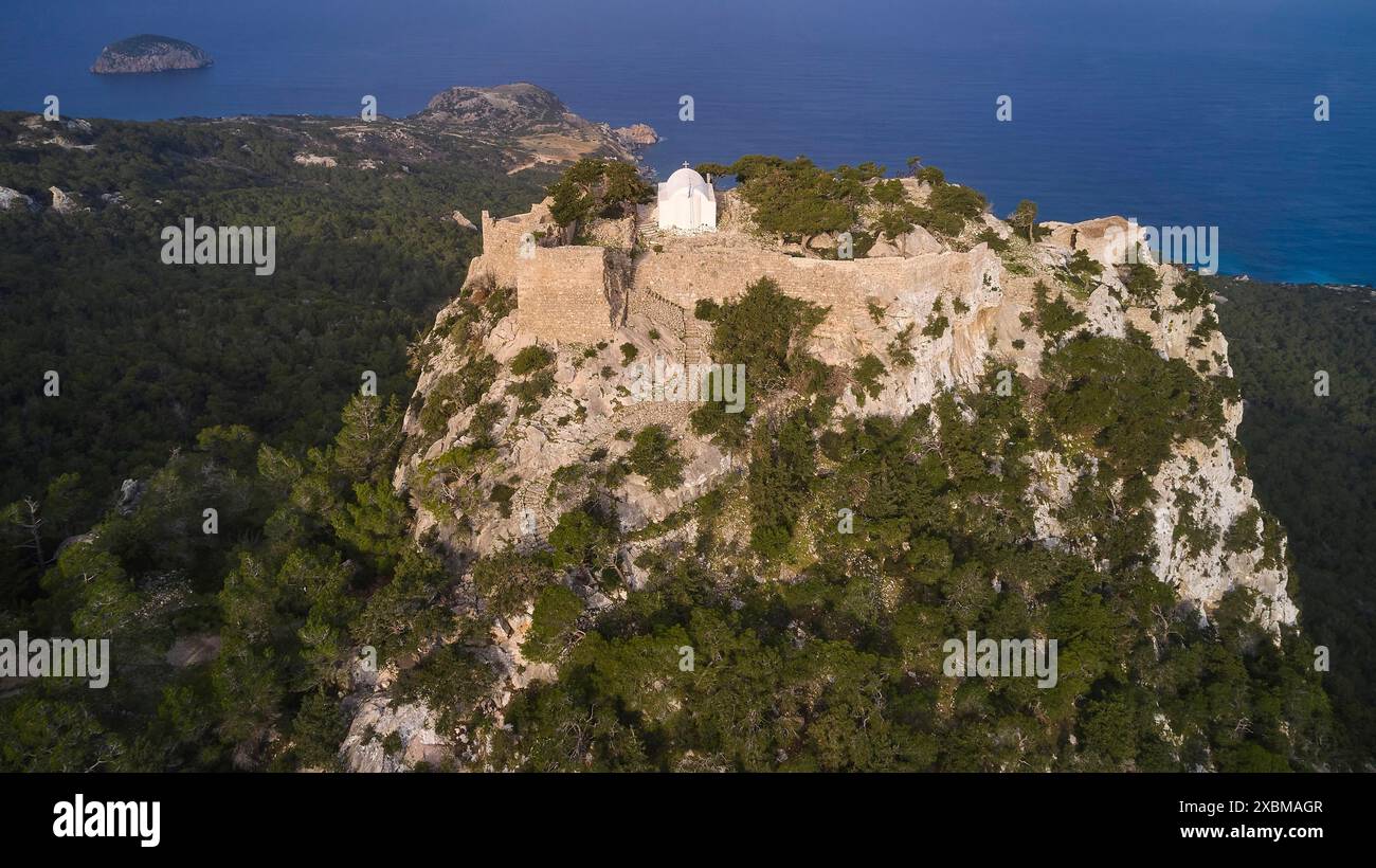 Aerial view of a castle on a wooded cliff on the coast, Kastro ...