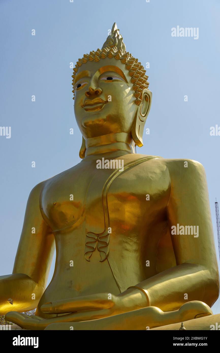 Large golden Buddha statue in front of a clear blue sky, Pattaya ...