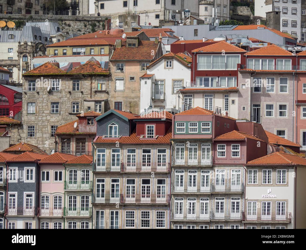 Interlocking residential buildings with tiled roofs and numerous ...