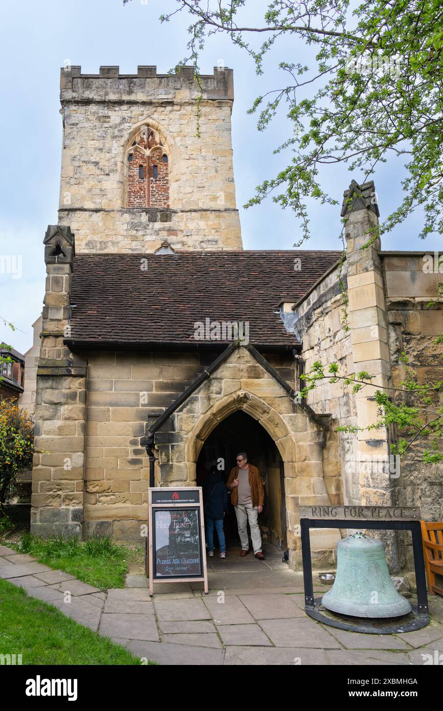 A Grade I listed former parish church, the Holy Trinity Church, Goodramgate, provides a glimpse of the Medieval world behind a busy street, York, UK Stock Photo
