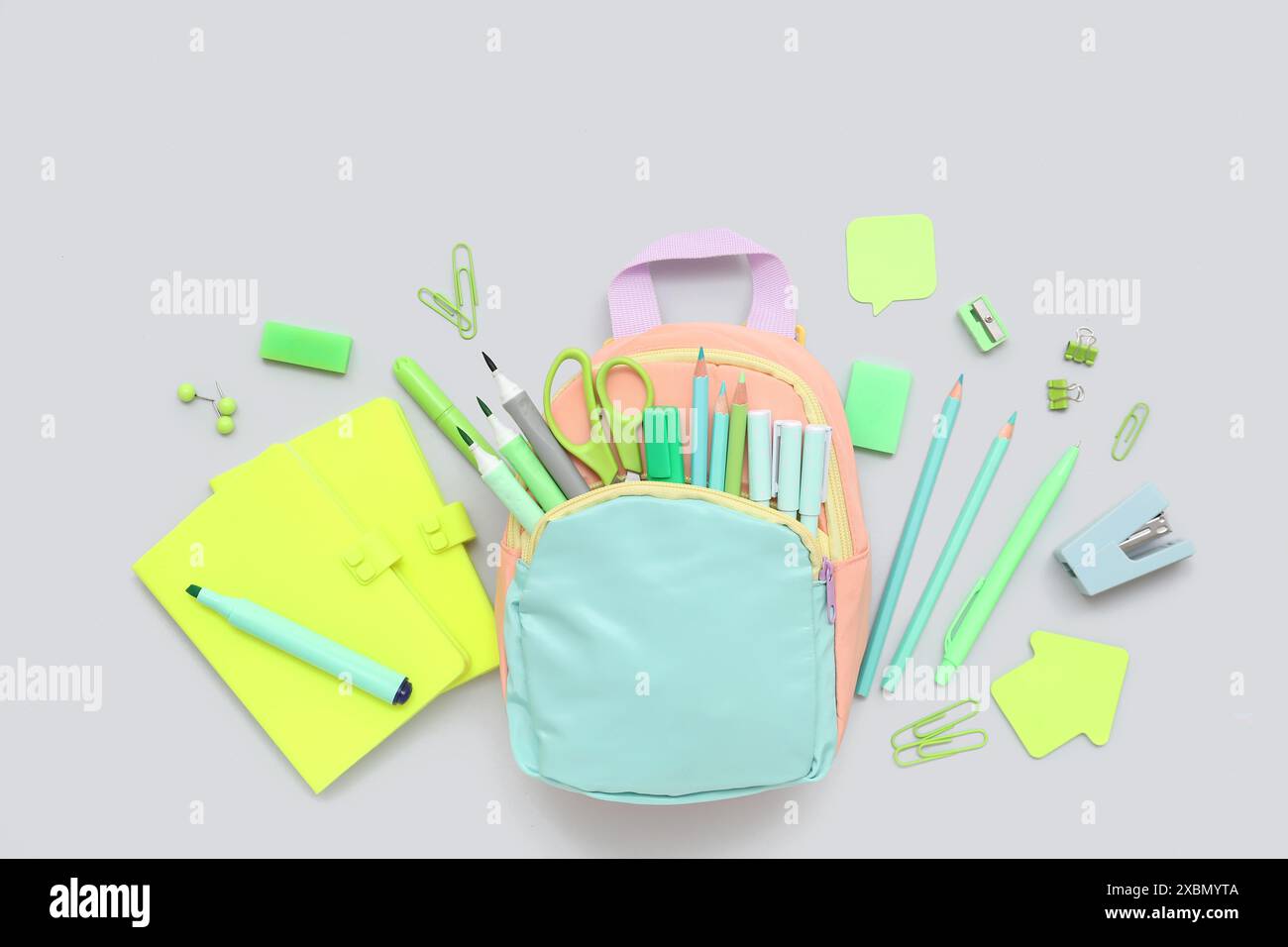 Composition with different stationery and stylish school backpack on grey background Stock Photo