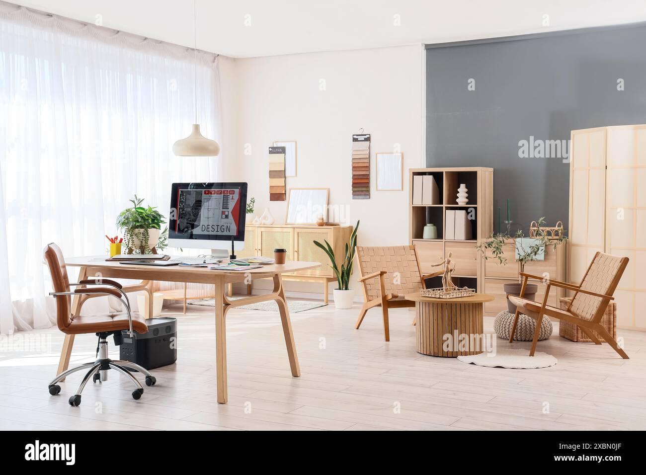 Interior of graphic designer's office with workplace and armchairs ...