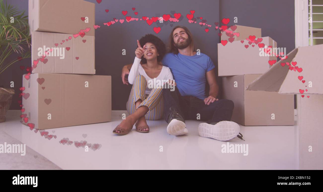 Sitting amongst boxes hi-res stock photography and images - Alamy