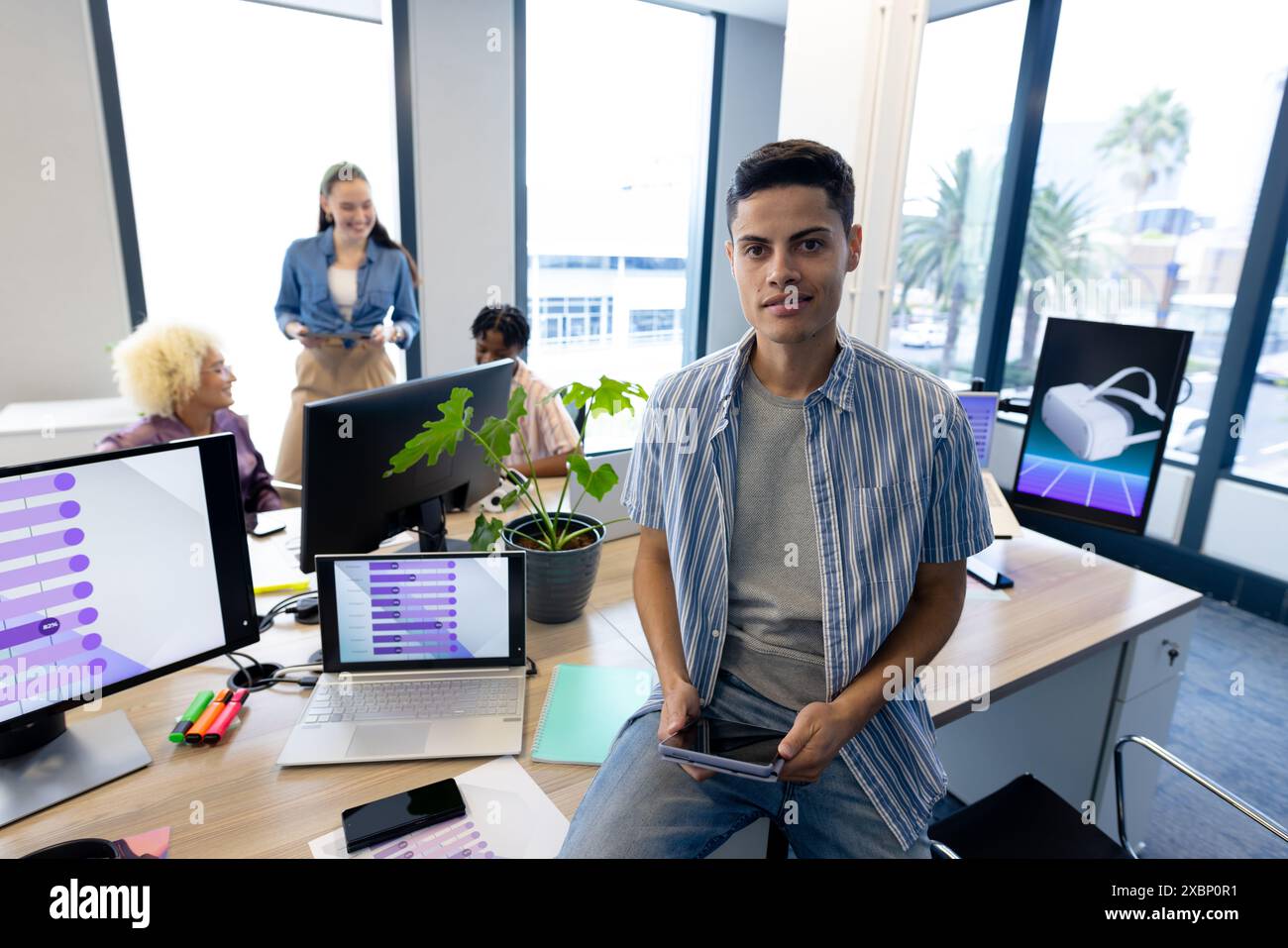 Colleagues in business collaborating on a startup in a modern office, copy space Stock Photo