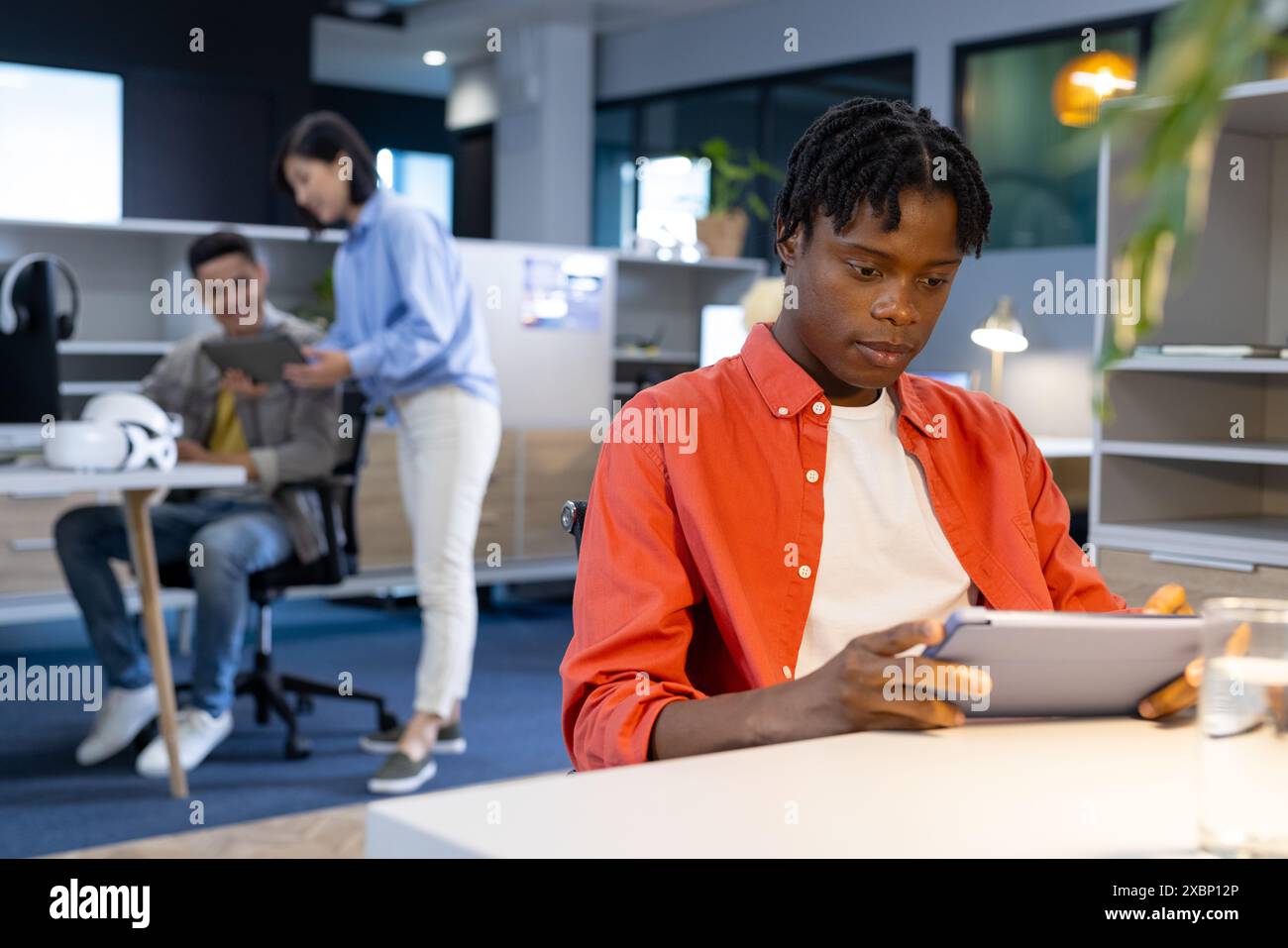 African american man using tablet at his business desk Stock Photo