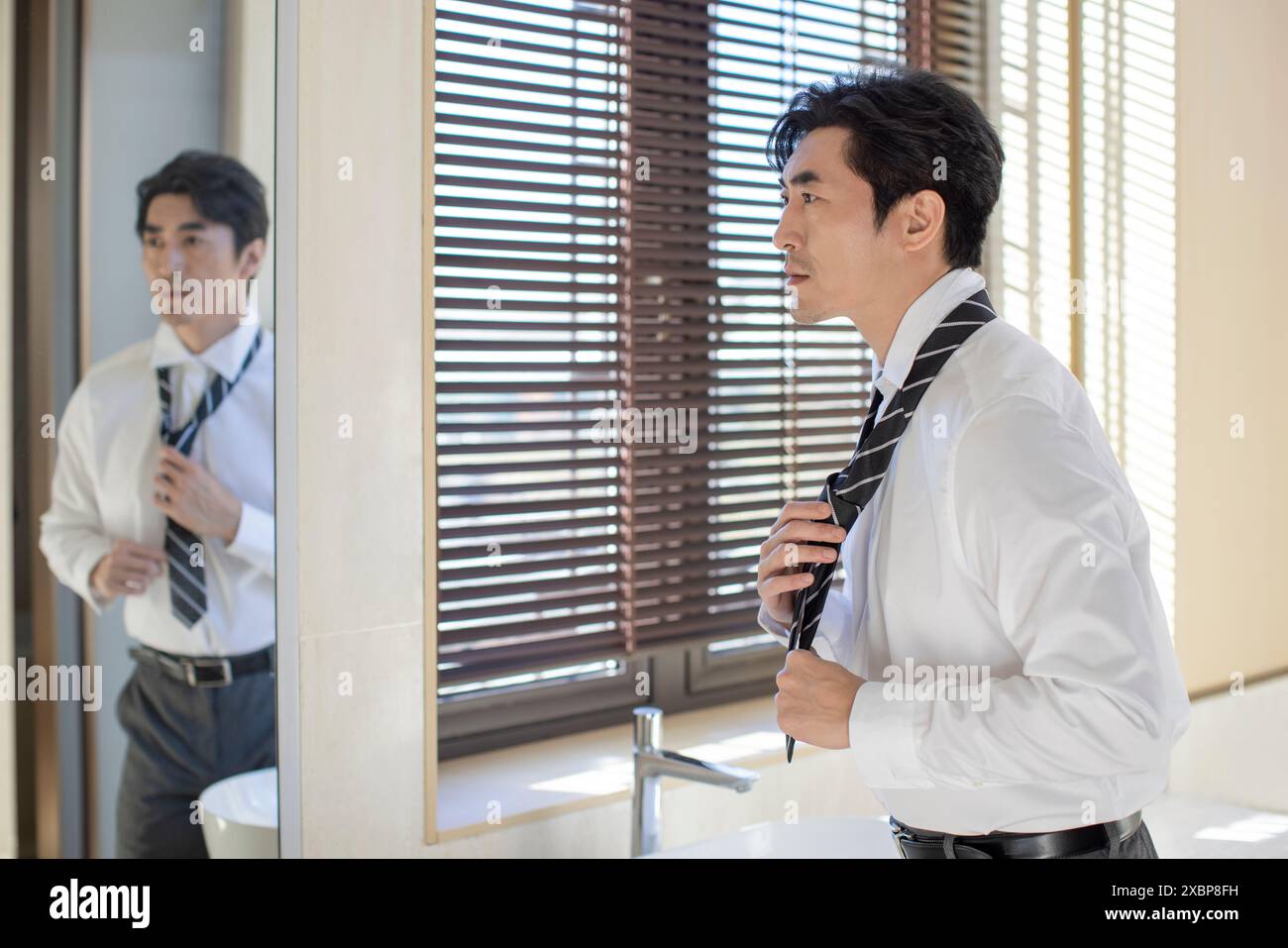Mature Businessman Wearing A Shirt And Tie Stock Photo - Alamy