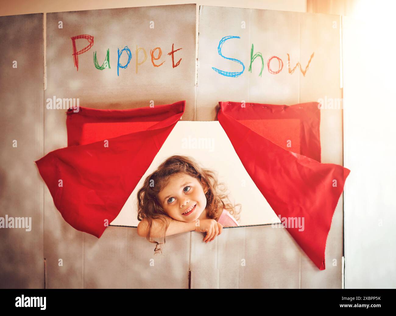 Curtain, puppet show and thinking with girl child in box window for