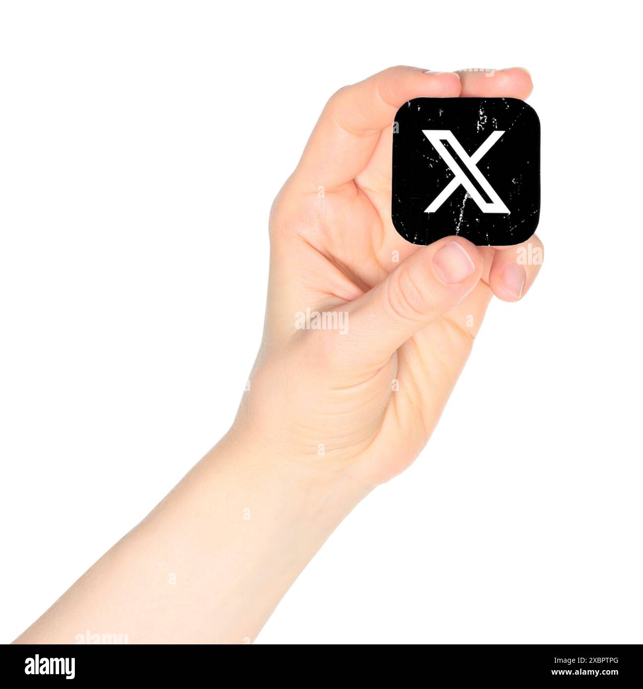 Hand holds X - Twitter icon on a white background. Popular social media ...
