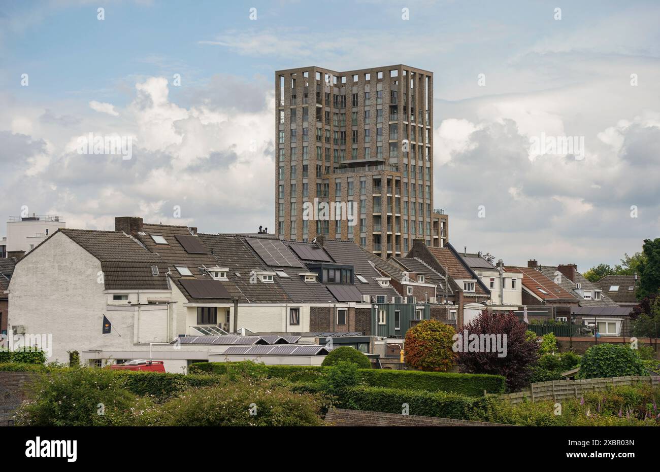 Modern apartment complex towering high rise, over old historic centre