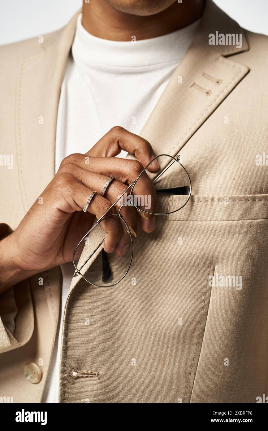 Stylish African American man in tan suit and sunglasses Stock Photo - Alamy