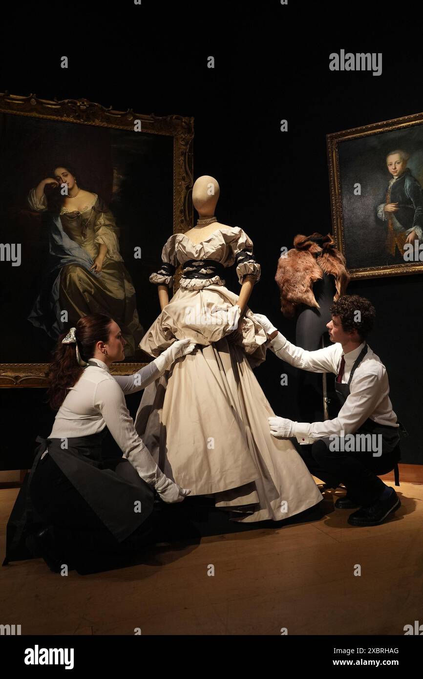 Gallery Assistants Adjust A Gown From Vivienne Westwood s Dressed To gallery-assistants-adjust-a-gown-from-vivienne-westwood-s-dressed-to
