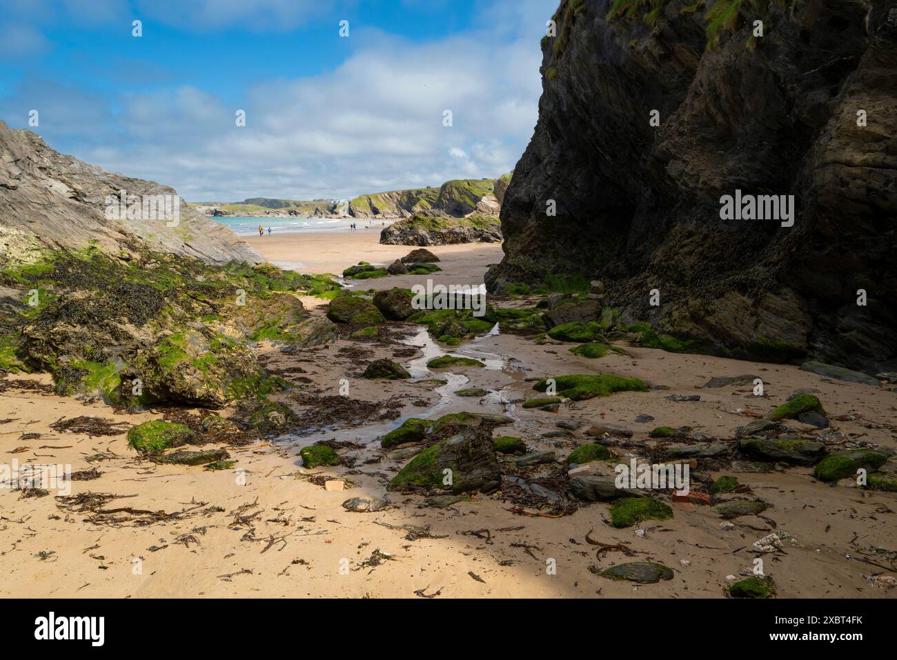 The rugged rocks below cliffs on Great Western Gt Western beach in ...