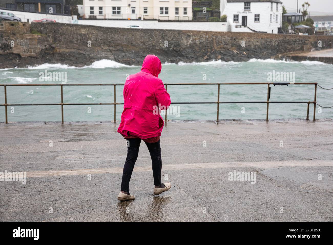 Porthleven, Cornwall, 13th June 2024, Strong winds and heavy rain caused rough seas in Porthleven, Cornwall, as it crosses the South West travelling across the UK. The Temperature was 13C and the forecast is for the gusty winds and thunderstorms to continue for the next two days. Current Temperatures are below average for the time of year. Credit: Keith Larby/Alamy Live News Stock Photo