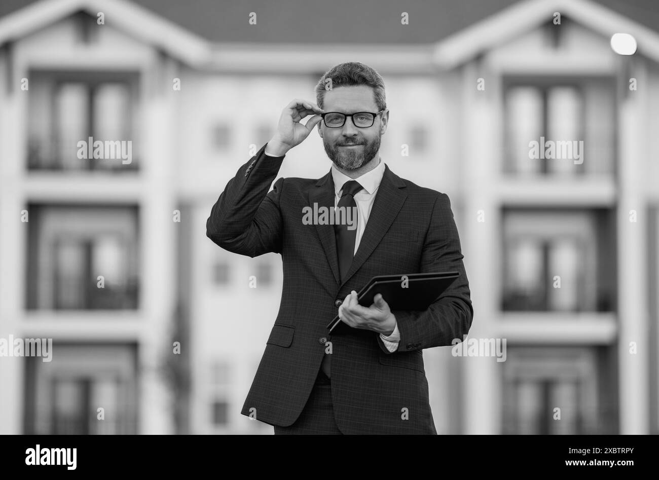 Real estate agent business man in suit hold holder clipboards outside. Hispanic Businessman. Special offer. Business deal. Job offer, Purchase offer Stock Photo