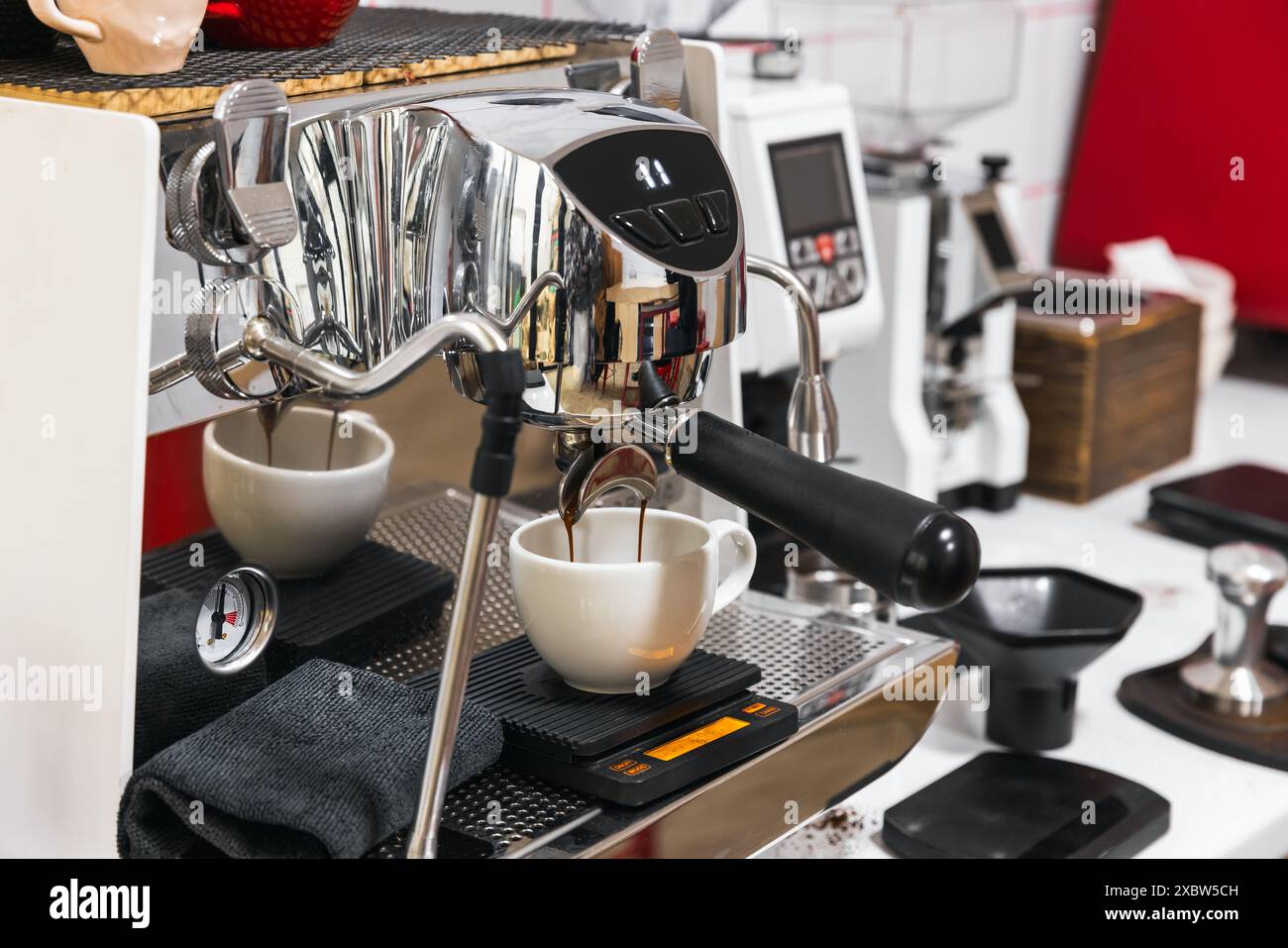 Coffee machine makes an espresso coffee, close up photo with selective soft focus Stock Photo