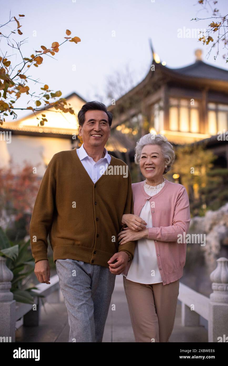 Senior Couple Taking a Walk in Park Stock Photo - Alamy