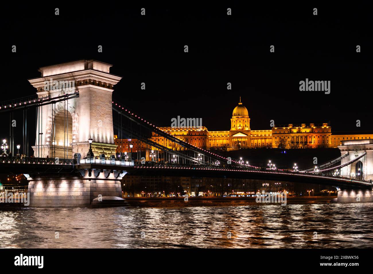 The historical Buda castle district above the Danube river illuminated ...