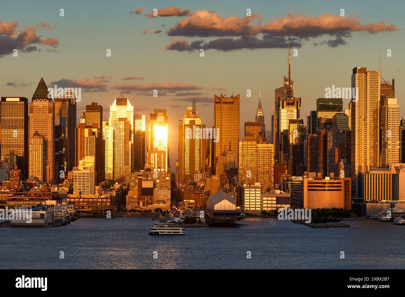 View across Hudson River of New York City skyline at sunset. Midtown ...