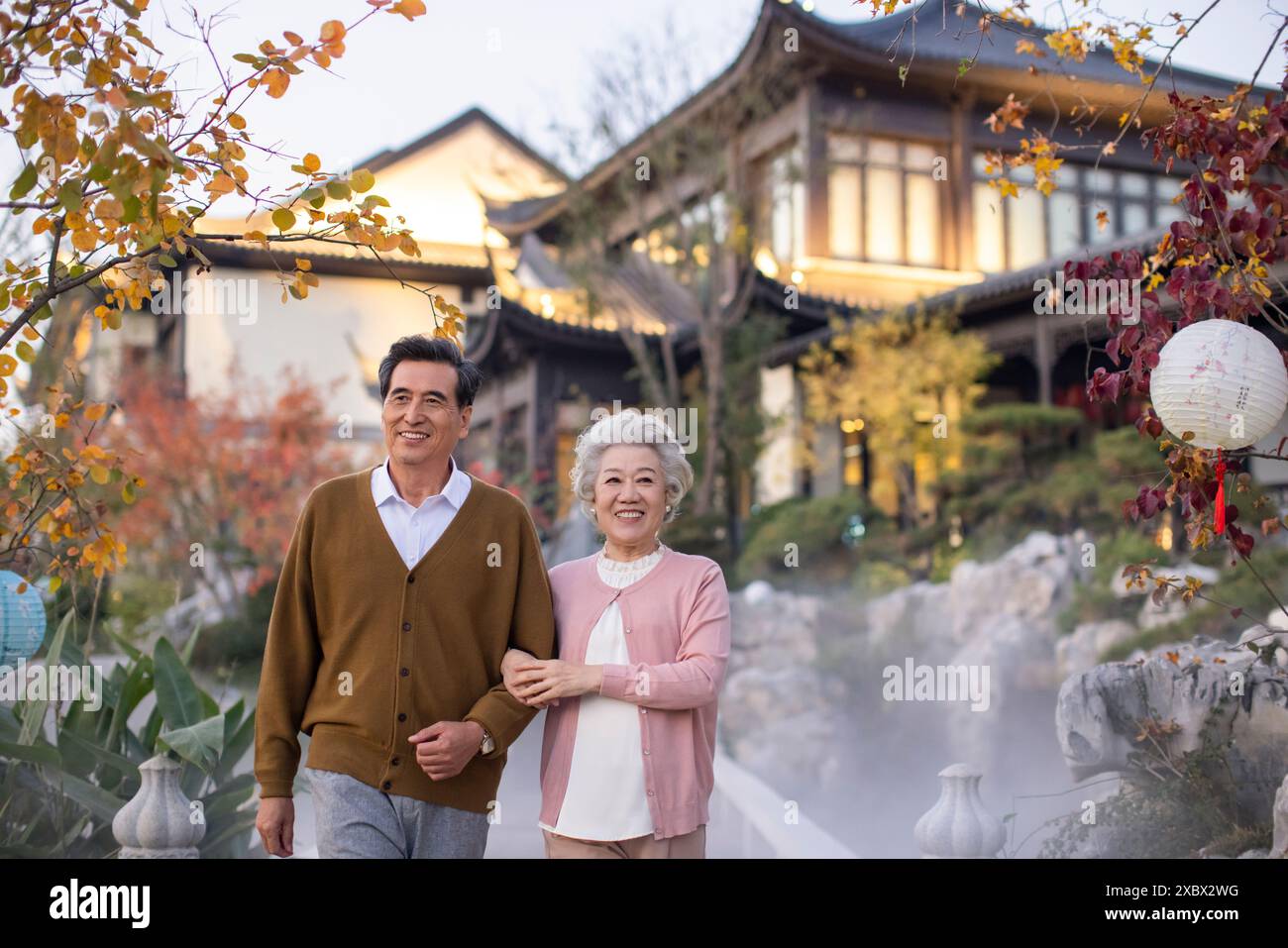 Senior Couple Taking a Walk in Park Stock Photo - Alamy