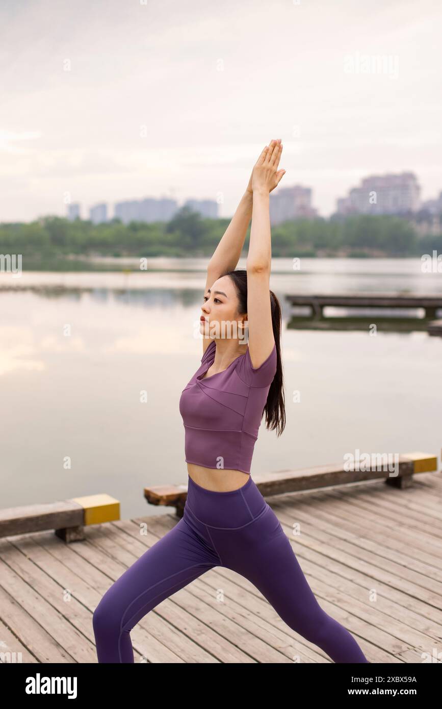 Young woman lake exercises yoga hi-res stock photography and images - Alamy
