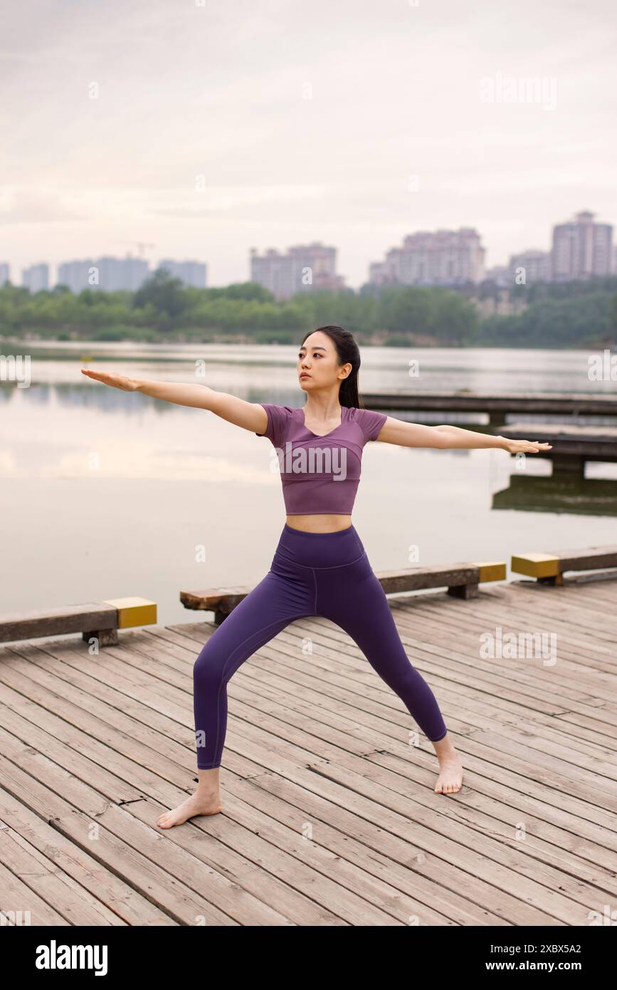 Young woman lake exercises yoga hi-res stock photography and images - Alamy