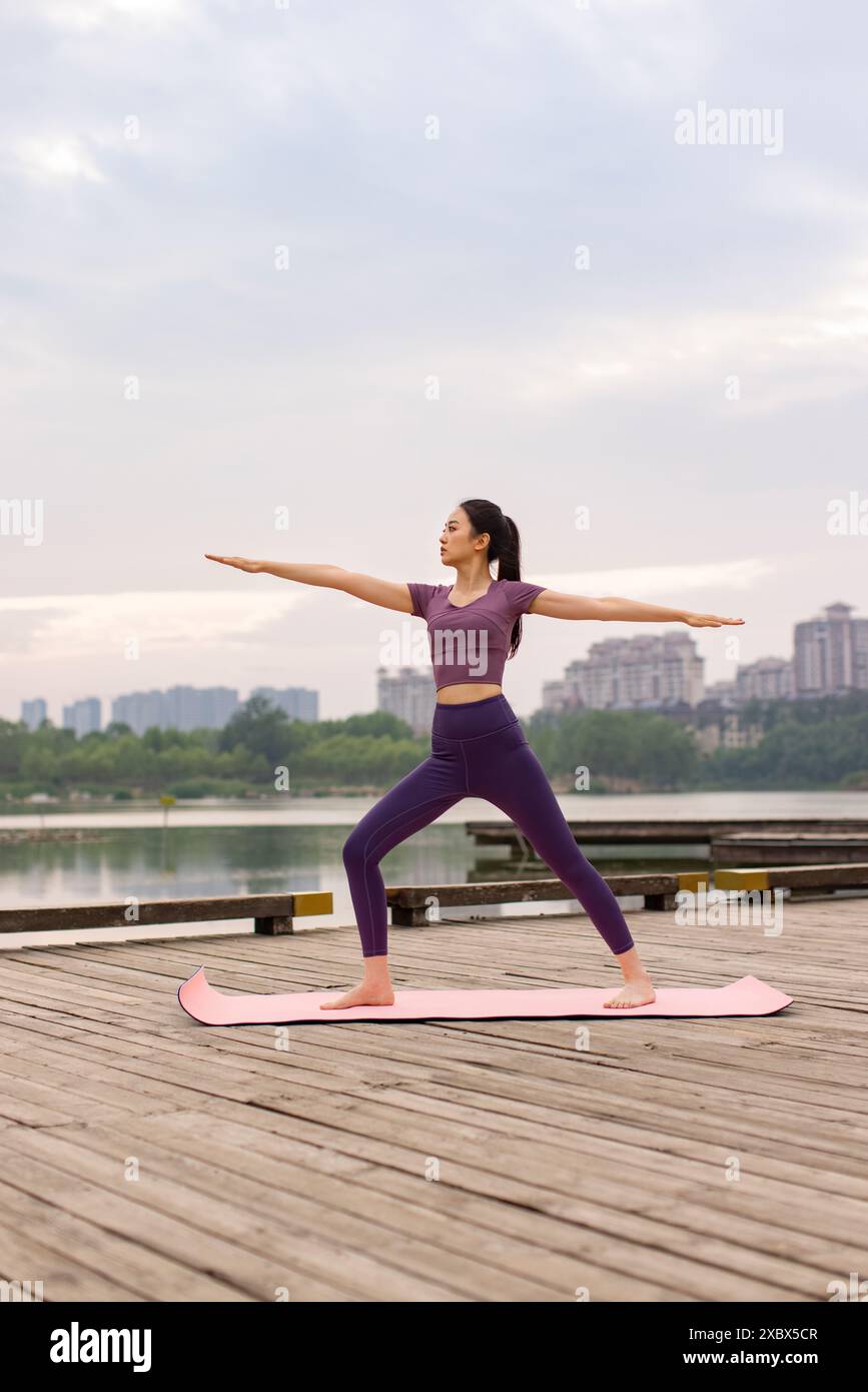 Young woman lake exercises yoga hi-res stock photography and images - Alamy