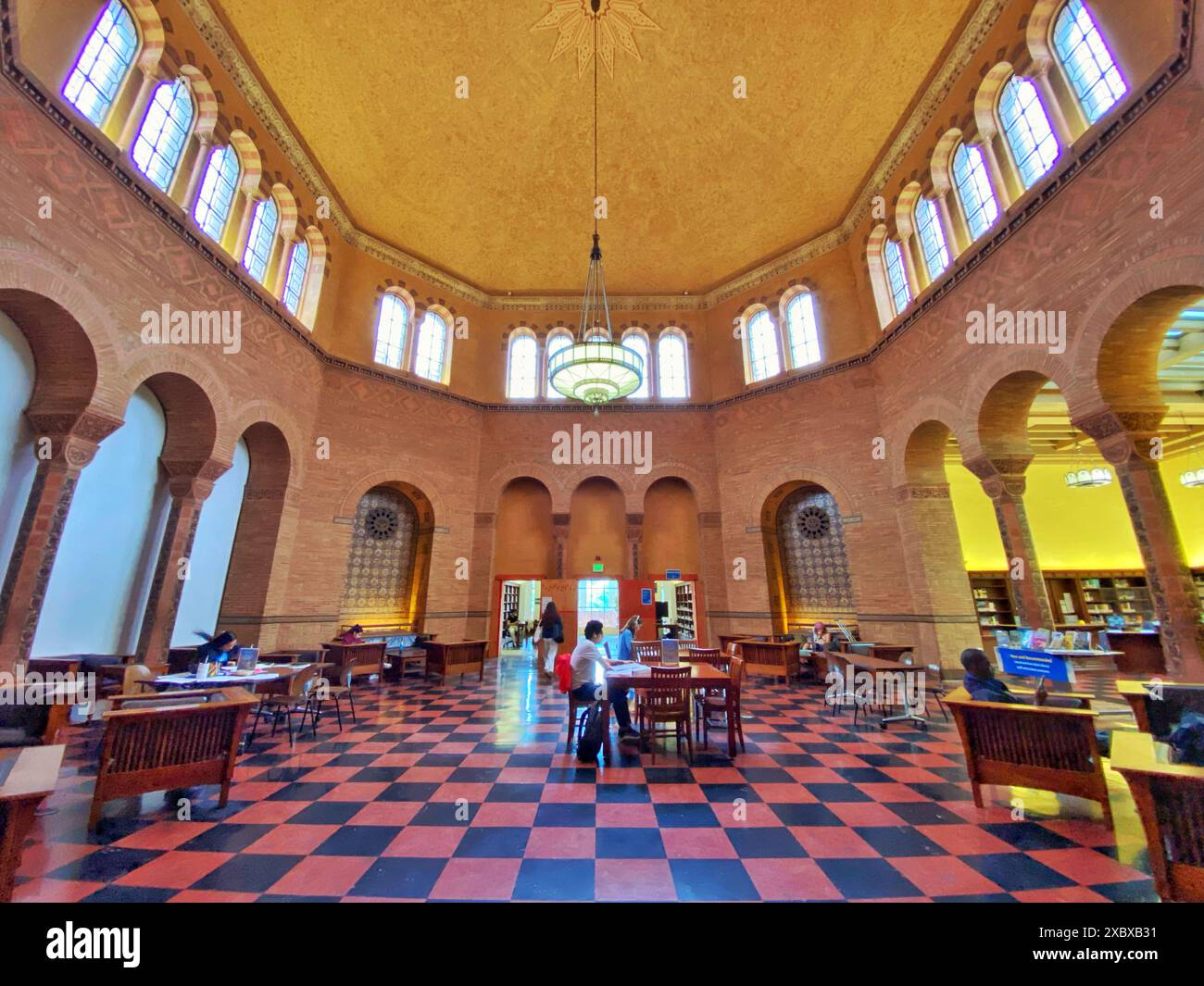 UCLA students studying in the reading room of Powell Library at the