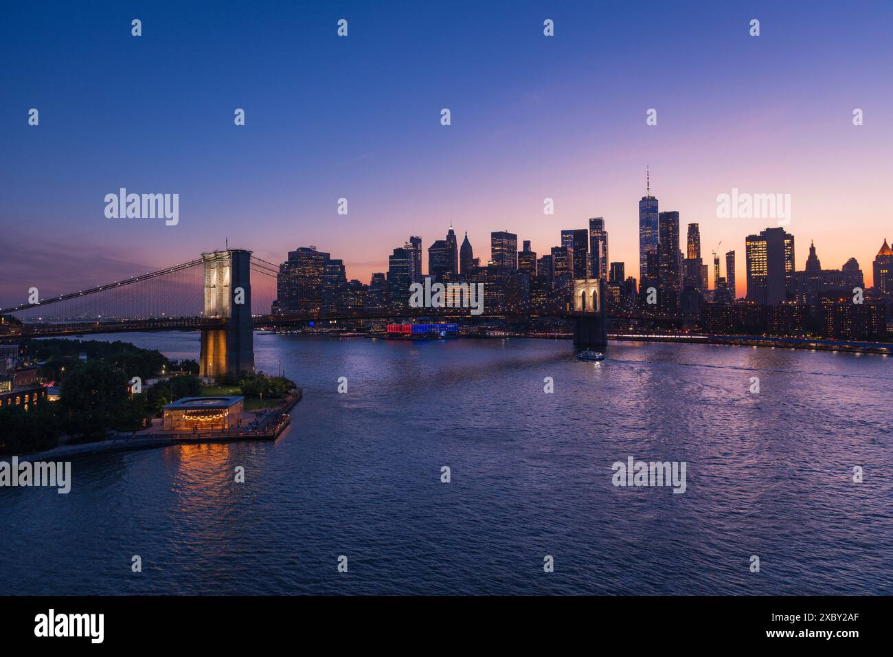 Brooklyn Bridge and New York City skyline across the East River ...