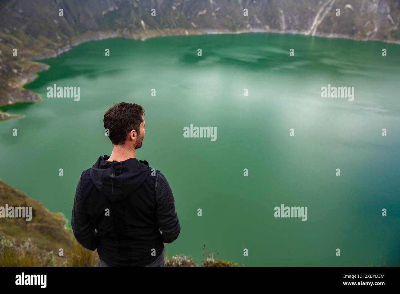 The Quilotoa crater with a bright green lake is a beautiful landscape ...