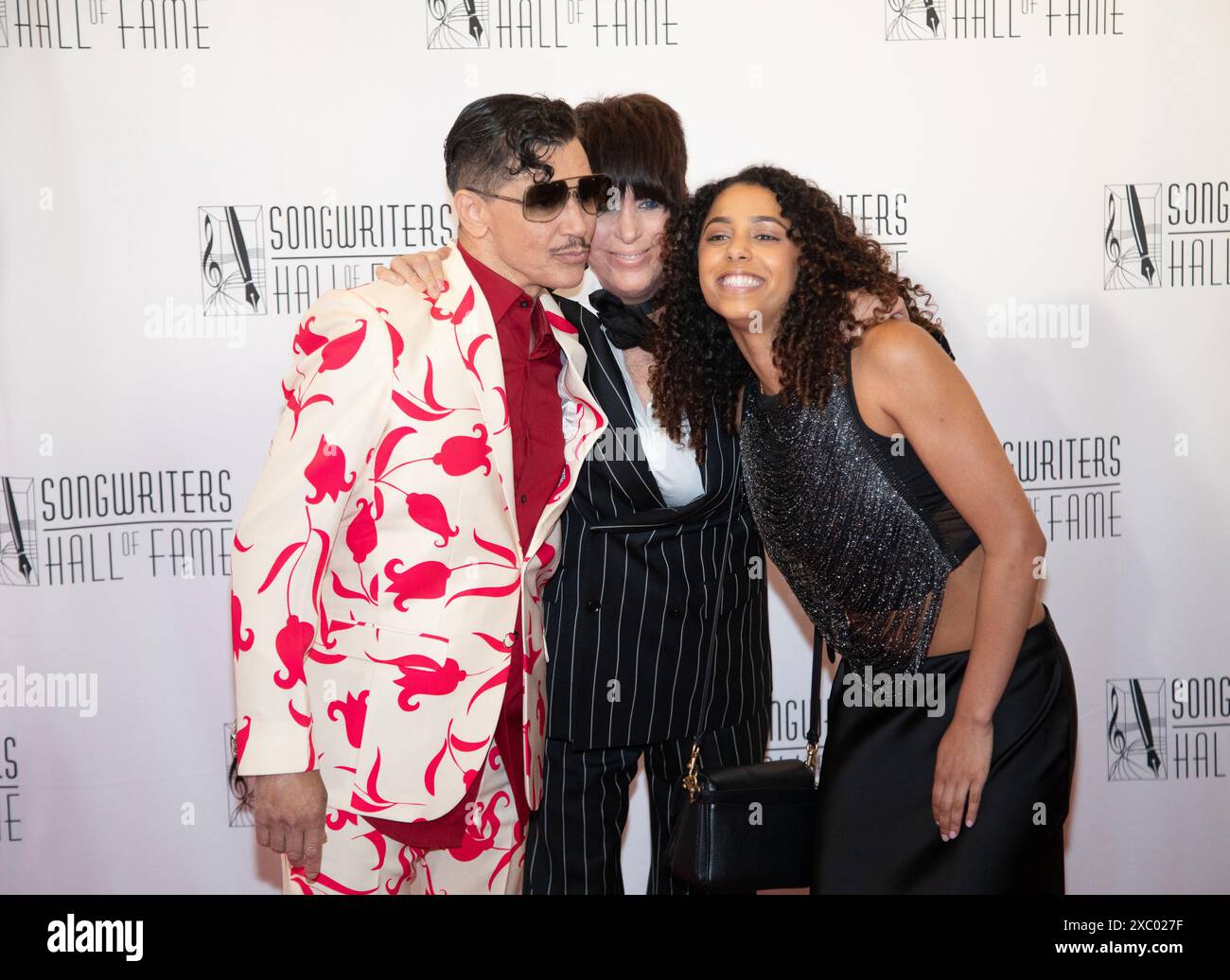 New York, United States. 13th June, 2024. El DeBarge, Diane Warren and Adris DeBarge arrive on the red carpet at the 2024 Songwriters Hall of Fame Induction and Awards Gala at New York Marriott Marquis Hotel on Thursday, June 13, 2024 in New York City. Photo by Serena Xu Ning/UPI Credit: UPI/Alamy Live News Stock Photo