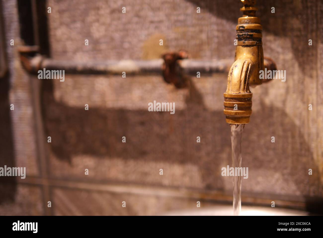 Water drop from water tap Stock Photo - Alamy