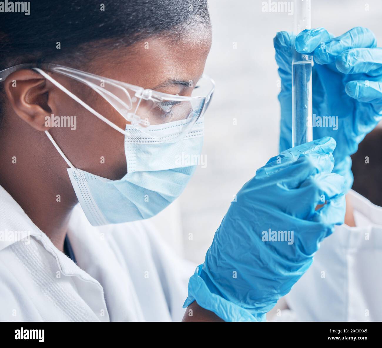 Black woman, science and research in lab with test tube for medical ...